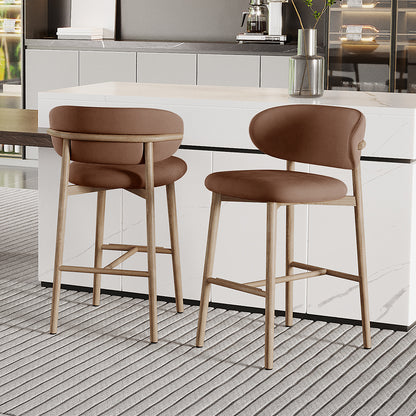 Audrey Velvet Fabric Upholstered Barstool Mocha Mousse Set of 2, featuring light wood frames, padded seats and backs, positioned at a marble-look counter in a modern kitchen setup.