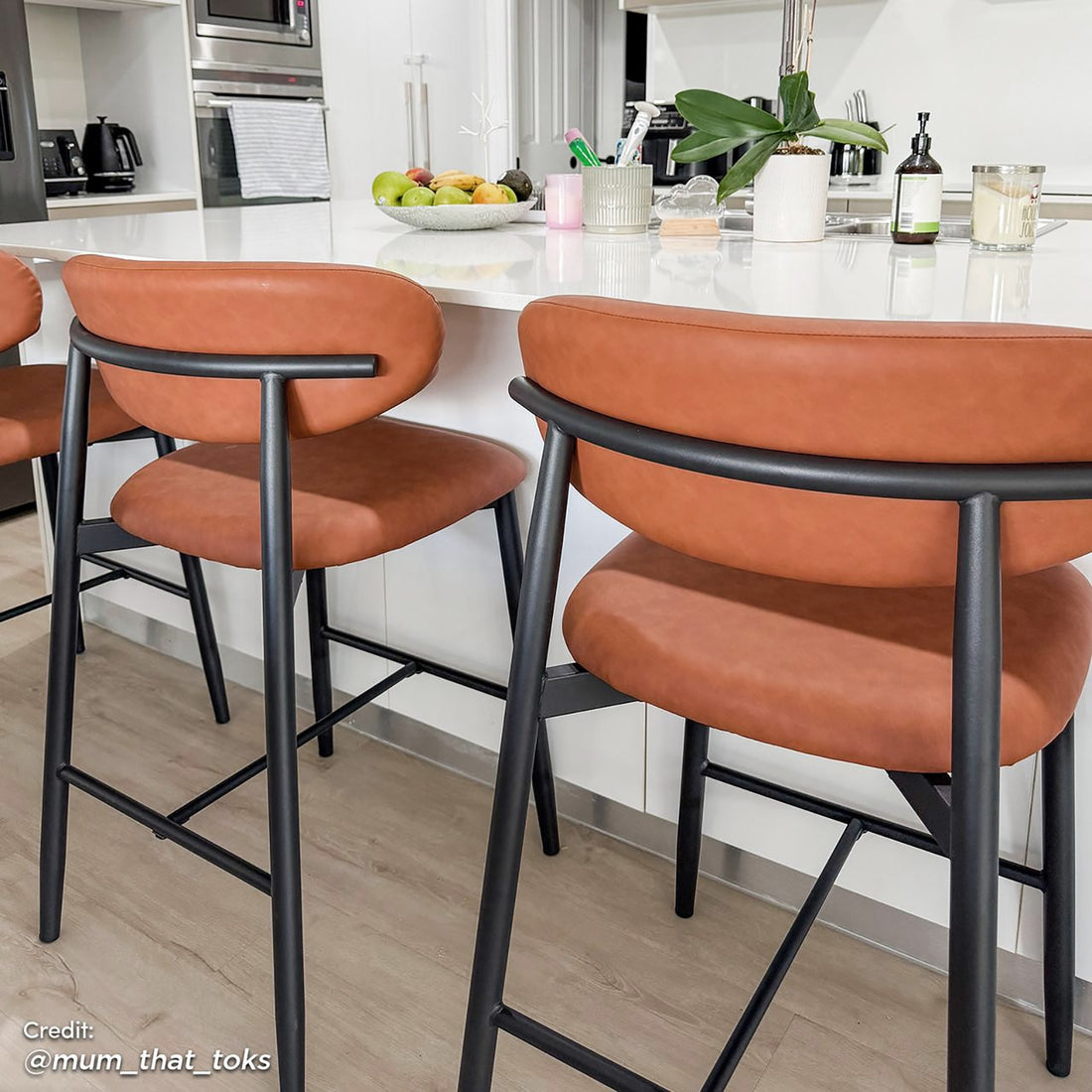 Audrey PU Leather Upholstered Barstool Set of 2 - Tan, featuring sleek PU leather seats, plush foam padding, and sturdy black metal legs with anti-slip pads, perfect for modern interiors.