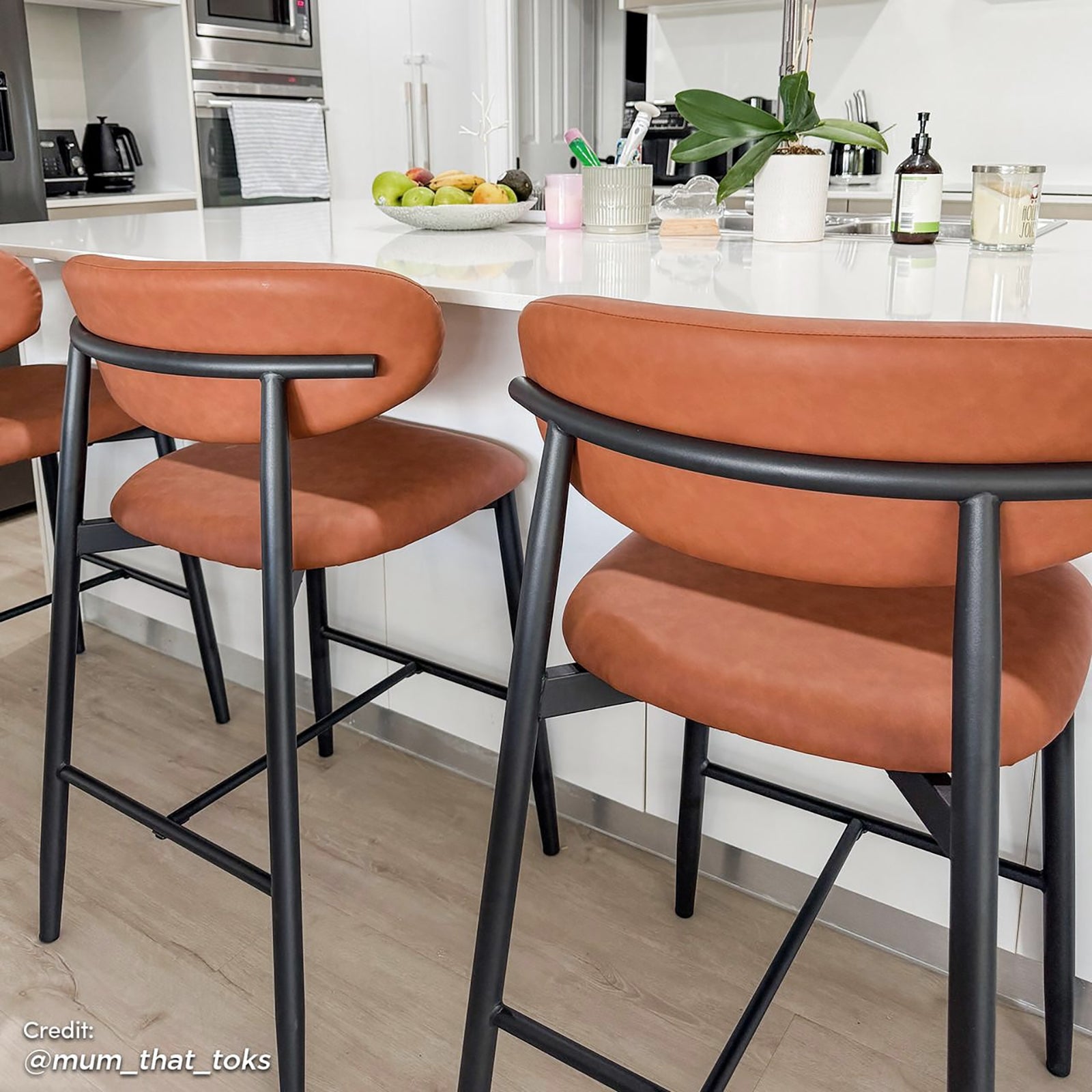 Audrey PU Leather Upholstered Barstool Set of 2 - Tan, featuring sleek PU leather seats, plush foam padding, and sturdy black metal legs with anti-slip pads, perfect for modern interiors.