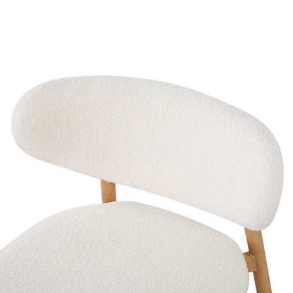 Audrey Curved Fabric Dining Chair Set of 2 in Cream White, featuring padded backrest and seat in off-white bouclé fabric, complemented by a light wood frame, exuding modern elegance and comfort.