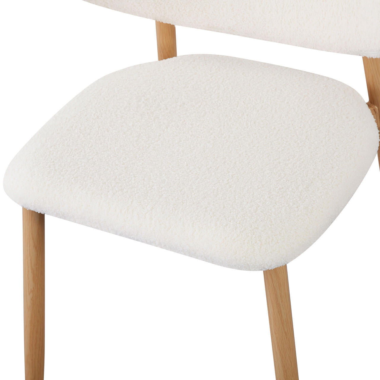 Audrey Curved Fabric Dining Chair Set of 2 in Cream White, featuring light-wood frame, softly rounded padded seat, textured off-white upholstery, and partially visible backrest, epitomizing refined elegance and comfort.
