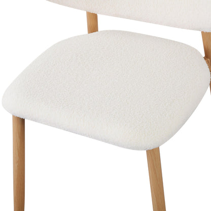 Audrey Curved Fabric Dining Chair Set of 2 in Cream White, featuring light-wood frame, softly rounded padded seat, textured off-white upholstery, and partially visible backrest, epitomizing refined elegance and comfort.