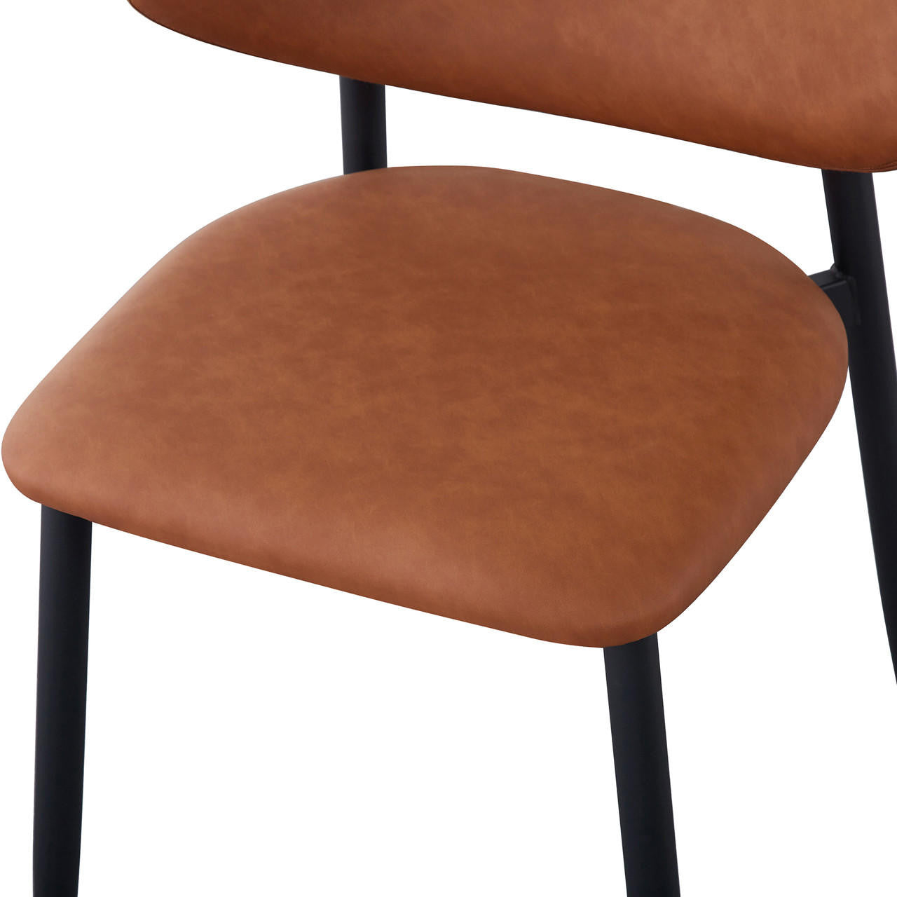 Audrey Curved Leather Dining Chair Set of 2 in Tan, featuring cognac-brown upholstered cushion on sleek black metal frame, showcasing modern design with plush padding and sturdy legs for stylish comfort.