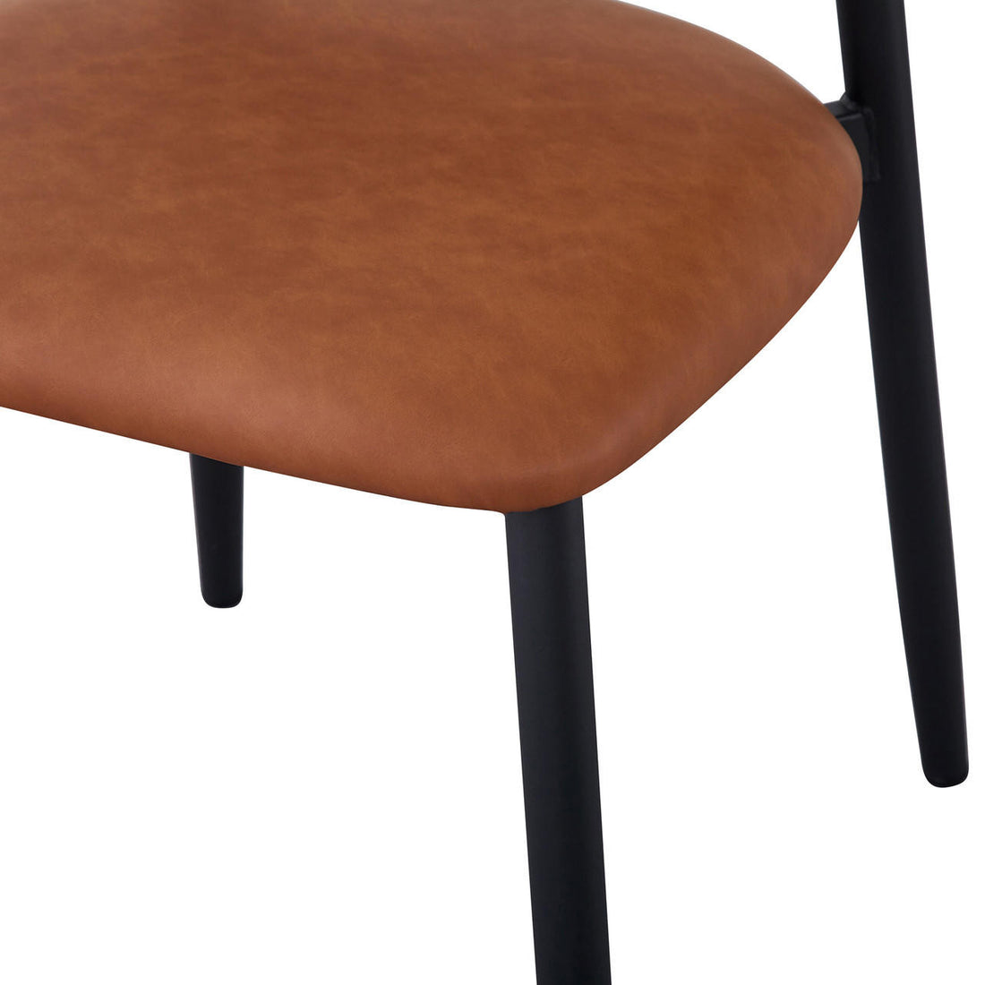 Audrey Curved Leather Dining Chair Set of 2 in Tan, featuring warm tan faux-leather upholstery and slender black metal legs, showcasing a sleek, modern design ideal for contemporary dining spaces.