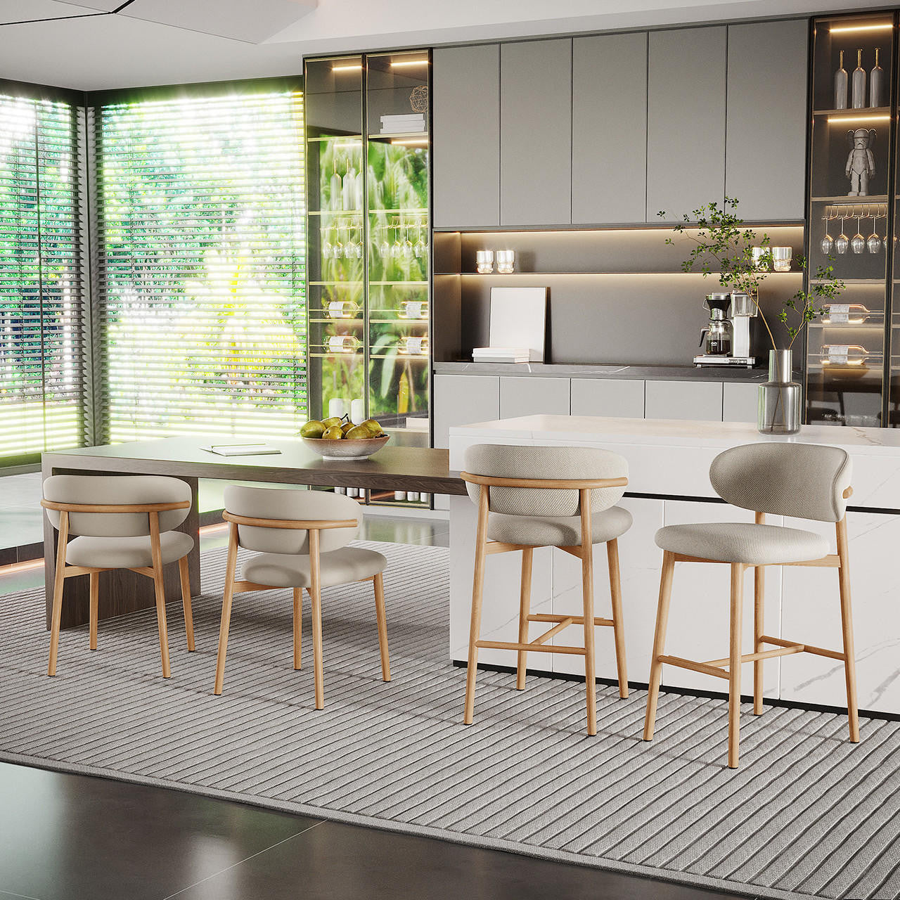 Audrey Curved Dining Chair & Bar Stool Bundle is showcased around a white marble-style island, featuring elegantly curved beige fabric upholstery and pale wood frames, complementing the upscale kitchen setting.