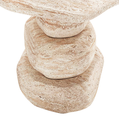 Three smooth, rounded beige stone-like objects are neatly stacked, resembling the sculptural form of the Azalea Round Indoor/Outdoor Concrete Dining Table Travertine, capturing its modern, artistic essence.