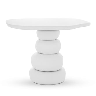 Azalea Round Indoor/Outdoor Concrete Dining Table White features a sculptural design with a rounded-square top and a base of stacked pebble shapes, emphasizing a minimalist, monolithic aesthetic.