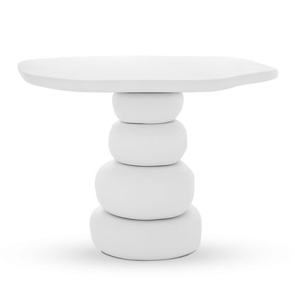 Azalea Round Indoor/Outdoor Concrete Dining Table White features a sculptural design with a rounded-square top and a base of stacked pebble shapes, emphasizing a minimalist, monolithic aesthetic.