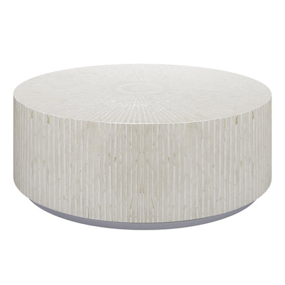 Baltoy 100cm Mother of Pearl Inlay Coffee Table in Sand, featuring a round, drum-style design with textured stone veneer mosaic and recessed base, creating a sophisticated, modern focal point.