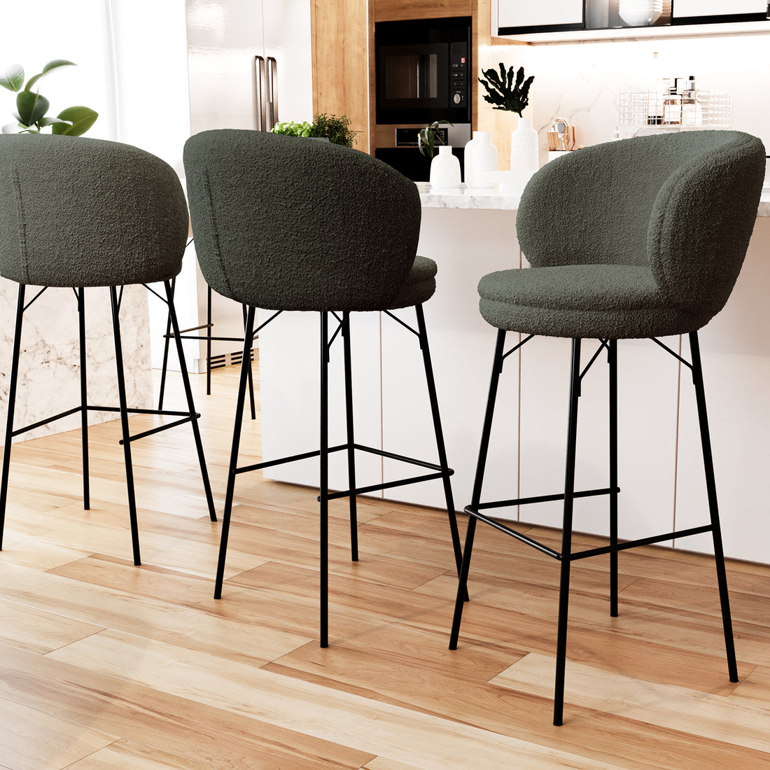 Belize High Back Boucle Bar Stool Set of 2 in Green features curved boucle seats, black metal legs, and footrests, arranged at a modern kitchen island with marble countertop and wood-tone cabinets.