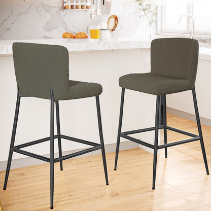 Bernie High Back Boucle Bar Stool Set of 2 in Green, featuring softly upholstered backs and seats, slender black metal legs, and a built-in footrest, complementing a modern kitchen island scene.
