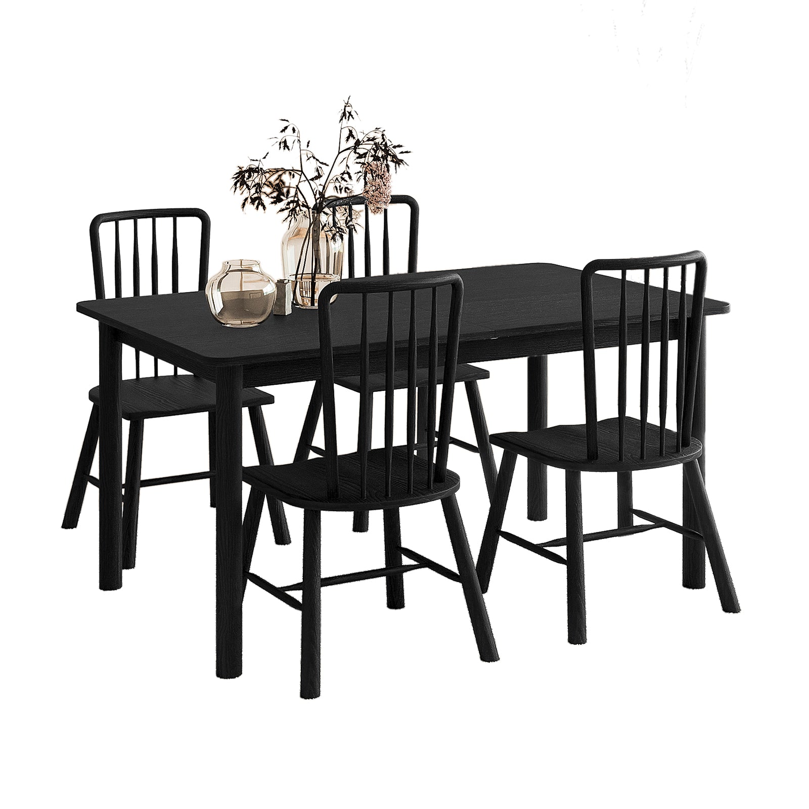 "Isolated view of the Luxo Living Bijan extendable dining table and four Leigh solid oak dining chairs in a sleek black finish, styled with decorative vases, on a white background.