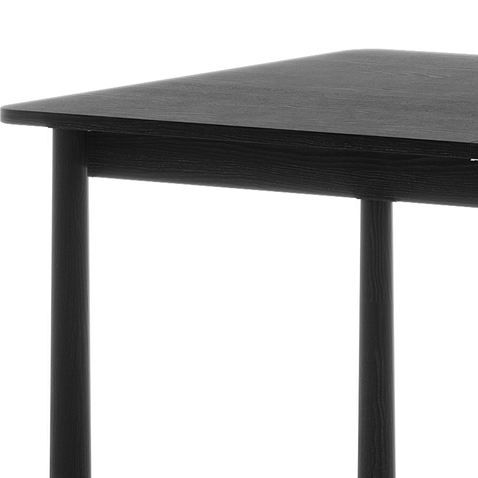 Close-up detail of the black solid oak wood finish and smooth, rounded edge of the Luxo Living Bijan extendable dining table, showing its subtle texture.