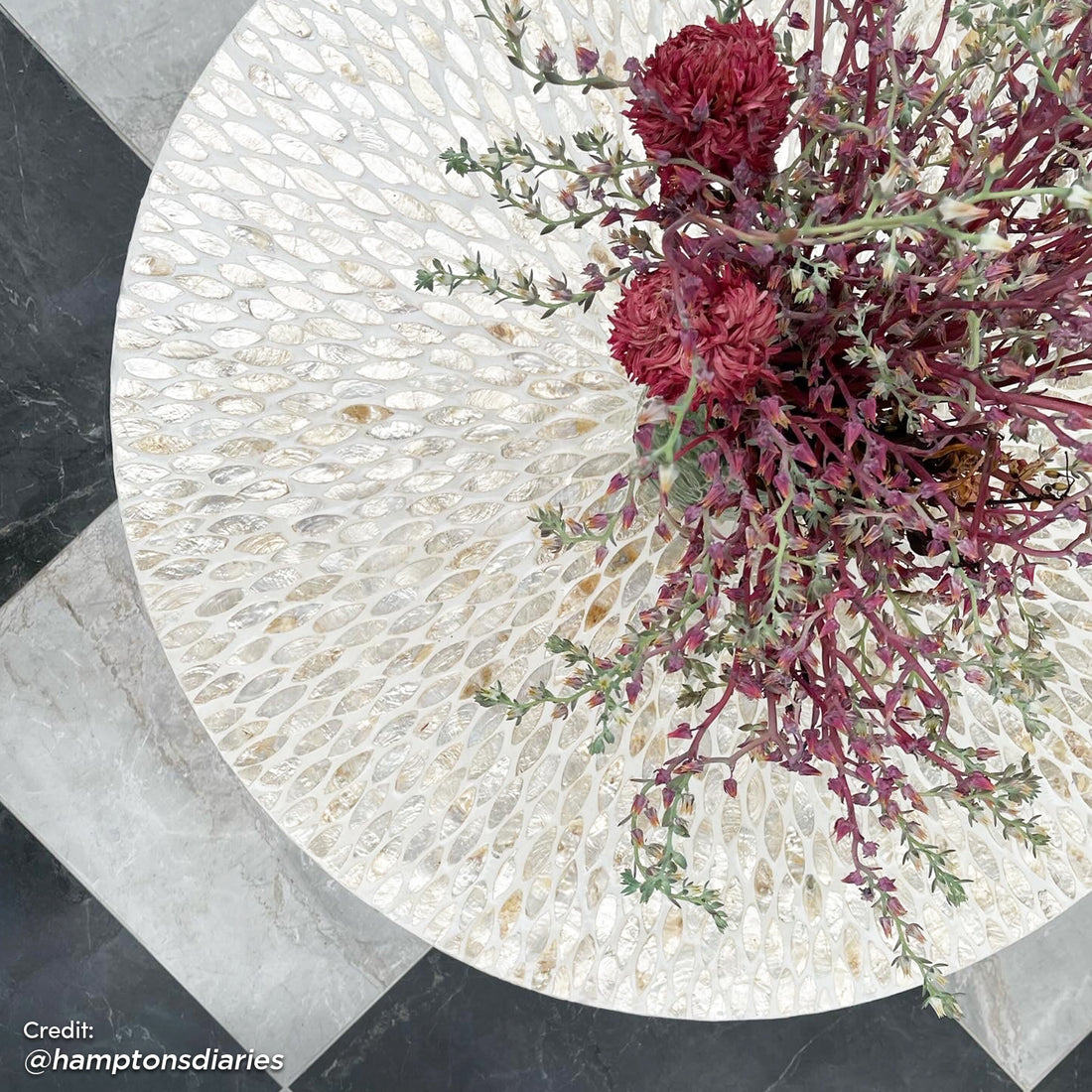 Bisera 91cm Mother of Pearl Inlay Coffee Table features a detailed mosaic of mother-of-pearl tiles, showcasing a hand-crafted, intricate floral design on its surface.