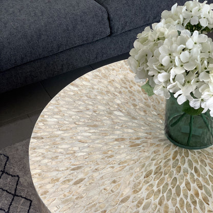 Bisera 91cm Mother of Pearl Inlay Coffee Table Beige showcasing intricate mosaic detailing on its surface, elegantly displayed with floral accents, highlighting its luxurious craftsmanship and unique design.