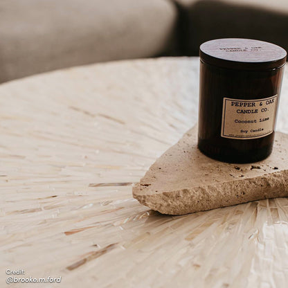 Bisera 91cm Mother of Pearl Inlay Coffee Table Cream, showcasing a hand-crafted mother-of-pearl mosaic top, placed elegantly on a stone surface, highlighting its intricate design and luxurious appeal.