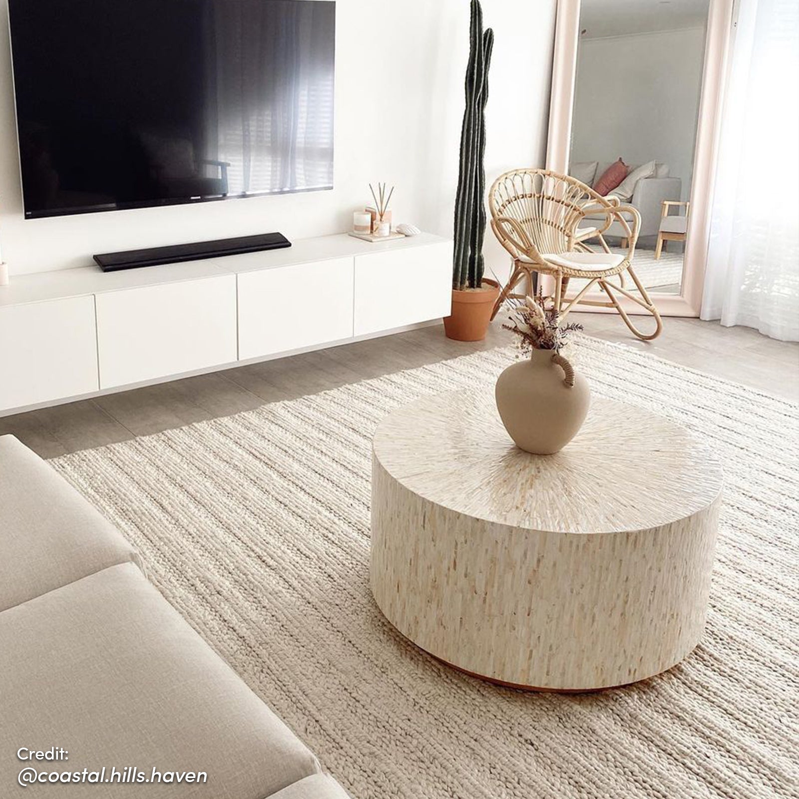 Bisera 91cm Mother of Pearl Inlay Coffee Table displayed in a room, showcasing its intricate hand-crafted mosaic design and sturdy base, ideal as a luxurious focal point in living spaces.