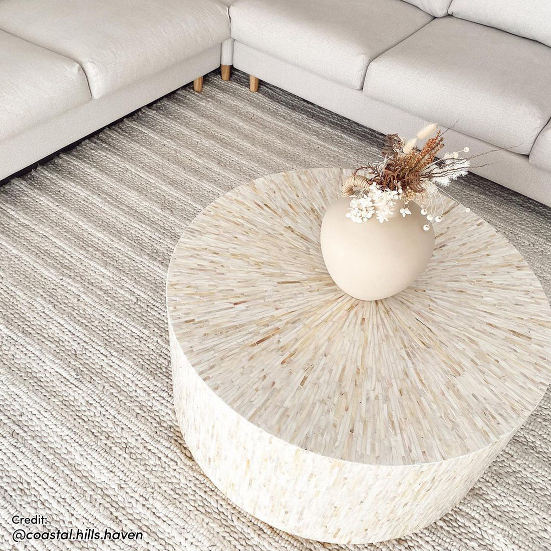 Bisera 91cm Mother of Pearl Inlay Coffee Table, featuring intricate hand-crafted mother-of-pearl mosaic on a cream tabletop, set against an elegant interior scene with a close-up view of its artistic detail.