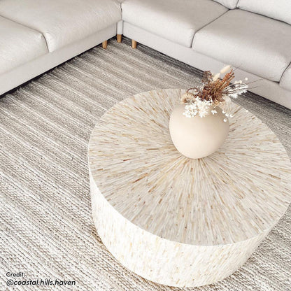 Bisera 91cm Mother of Pearl Inlay Coffee Table, featuring intricate hand-crafted mother-of-pearl mosaic on a cream tabletop, set against an elegant interior scene with a close-up view of its artistic detail.