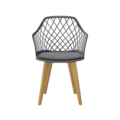 Caesar Beech Dining Chair Set of 4 in Dark Charcoal features a modern black lattice-patterned plastic seat with a round cushion, supported by natural-finish solid wood legs for a stylish, comfortable dining experience.