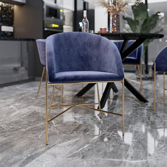 Catford Velvet Fabric Dining Chair Blue, featuring a velvet seat with sleek, gold-accented legs, designed for luxury and comfort in modern interiors, shown in a close-up and group setting.