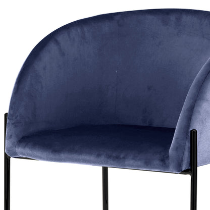 Catford Velvet Fabric Dining Chair Blue with sleek black legs, showcasing soft velvet texture and a curved seat design, perfect for modern or mid-century interiors.