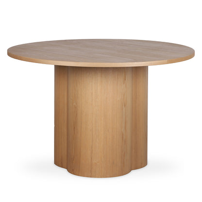 Cece 120cm Round Wooden Dining Table in Oak featuring a smooth, circular tabletop and solid cylindrical pedestal base, showcasing minimalist design with light natural wood and modern simplicity.