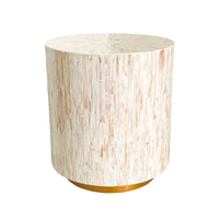 Chris 35cm Mother of Pearl Inlay Side Table in Cream, featuring a drum shape with narrow, iridescent mother-of-pearl tiles on its surface, set on a low, gold-finished base.
