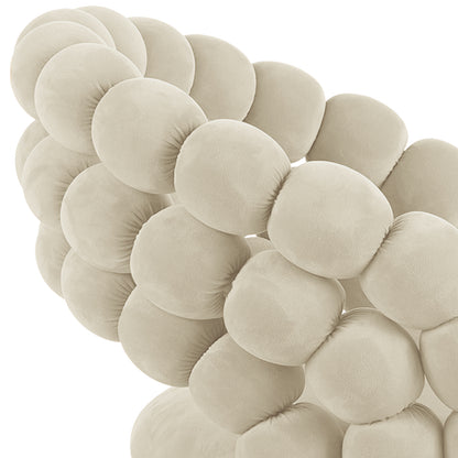 Claudine Velvet Curved Dining Chair Set of 2 in Oatmeal features a tufted, pillowed backrest and seat, showcasing the Hairball design. The modern, sculpted upholstery offers elegance and comfort for dining spaces.