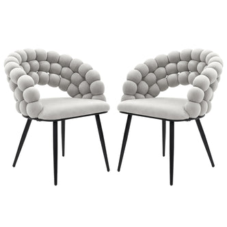Claudine Velvet Curved Dining Chair Set of 2 in Warm Grey features light-gray upholstered seats with distinctive rounded bubble backrests on slim black metal legs, offering modern elegance and comfort.