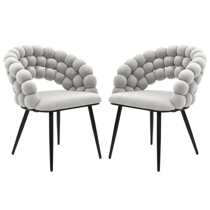 Claudine Velvet Curved Dining Chair Set of 2 in Warm Grey features light-gray upholstered seats with distinctive rounded bubble backrests on slim black metal legs, offering modern elegance and comfort.