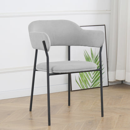 Clavin Fabric Dining Chair Set of 2 in Light Grey, features a modern design with padded upholstery, curved backrest, and slender black metal legs. Positioned in a minimalist setting with a palm print backdrop.
