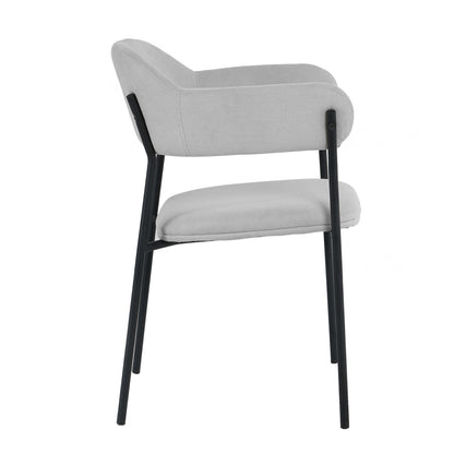Clavin Fabric Dining Chair Set of 2 in Light Grey featuring a lightly upholstered seat and back with low, rounded armrests on a slim black metal frame with four straight legs.