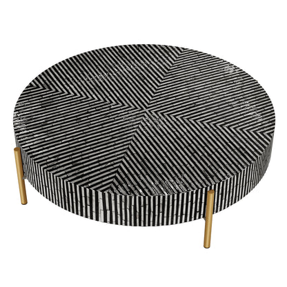 Cradily Mother of Pearl Inlay Coffee Table features a round top with black-and-white striped mosaic in chevron quadrants, standing on three slender brass-finished legs for an elegant, modern look.