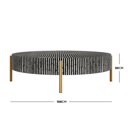 Cradily Mother of Pearl Inlay Coffee Table in Ivory & Black features a round tabletop with a vertical-striped mosaic pattern and four slim, gold-colored legs, offering a sophisticated and modern design.