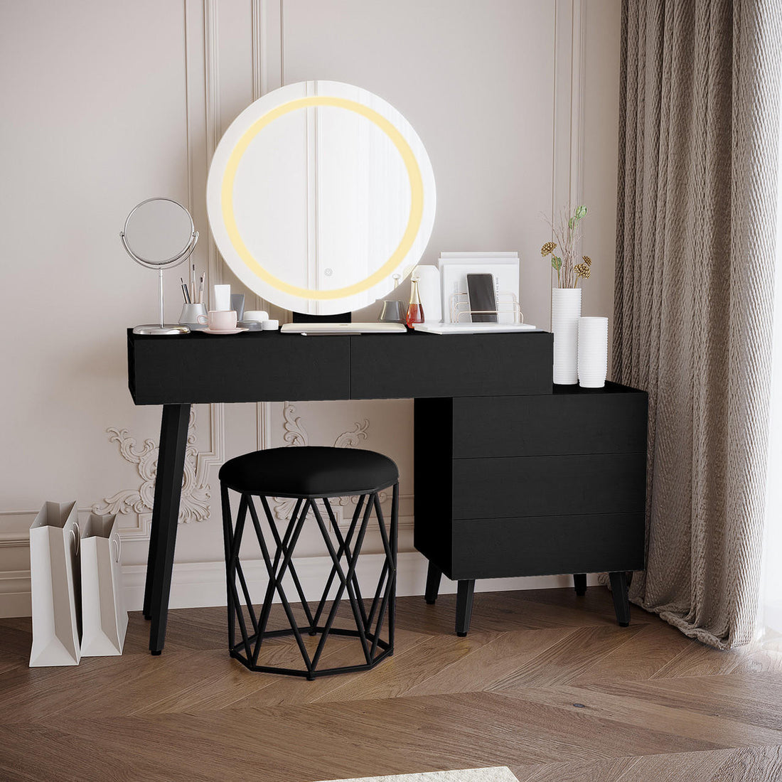 Demetria Dressing Table with LED Touch Mirror in Light Black featuring a matte black desk, round backlit mirror, and organized tabletop with cosmetics, vases, and wire organizer, complemented by a geometric-metal base stool.