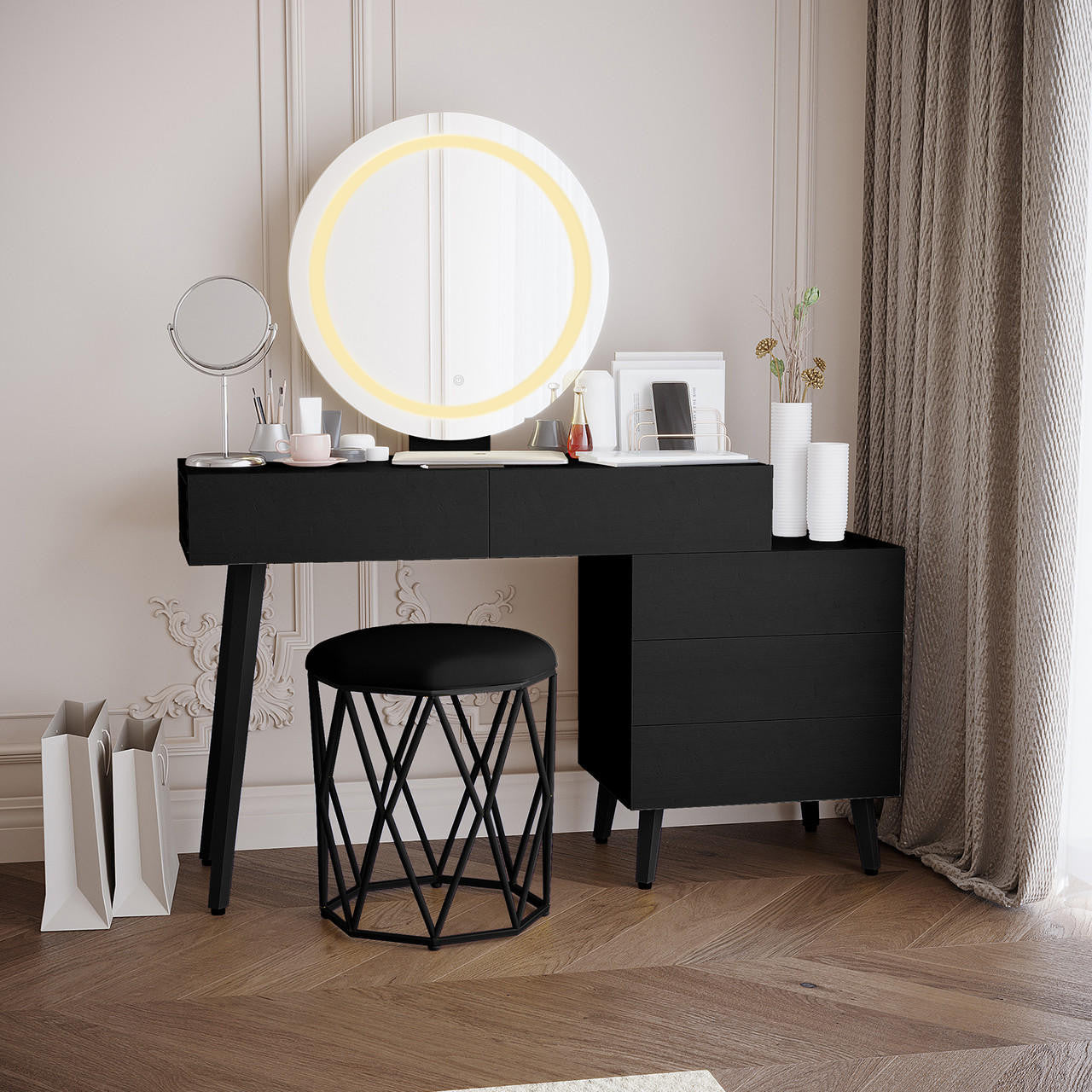 Demetria Dressing Table with LED Touch Mirror in Light Black featuring a matte black desk, round backlit mirror, and organized tabletop with cosmetics, vases, and wire organizer, complemented by a geometric-metal base stool.