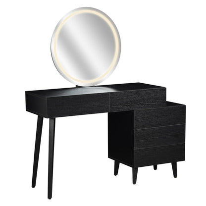 Demetria Dressing Table with LED Touch Mirror in Light Black features a modern asymmetrical design, two slender legs, a three-drawer cabinet, and a large round mirror with integrated LED lights.