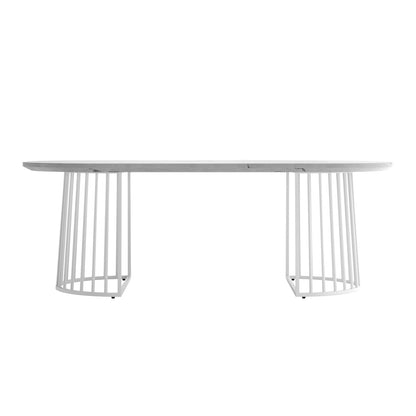 Devon 220cm 8 Seater Oval Industrial Dining Table in White, featuring a sleek marble-look top and dual open, cage-style metal bases, offering a modern, elegant focal point for dining spaces.