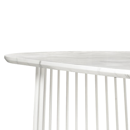 Devon 220cm 8 Seater Oval Industrial Dining Table in White features a marble-look tabletop supported by a cylindrical base of evenly spaced vertical metal rods, offering a modern and elegant design.