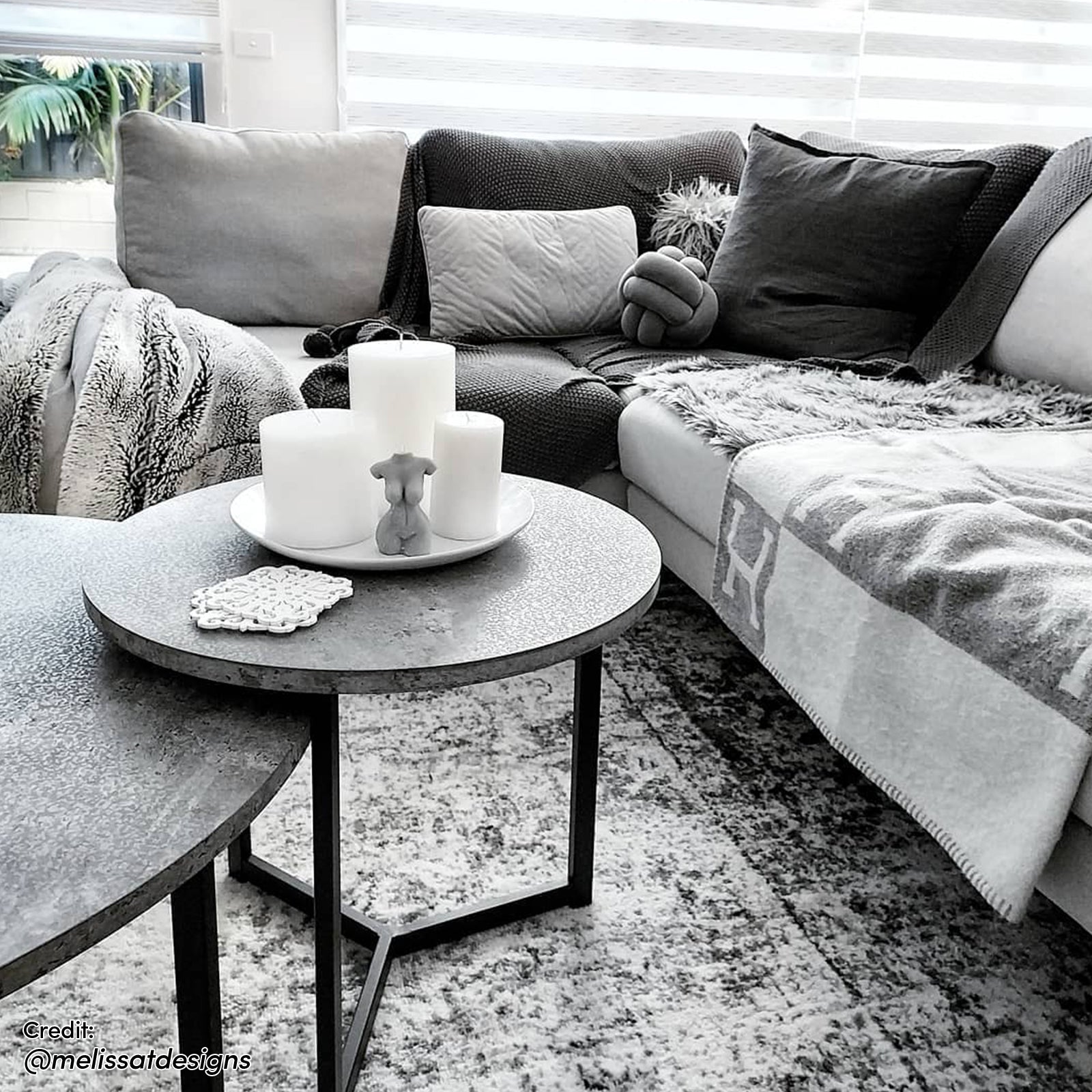 Earl Nesting Coffee Table Set of 2 - Concrete, showcasing sleek round tabletops and a sturdy metal frame, ideal for modern interiors with versatile, space-saving design. Displayed in a contemporary indoor setting.