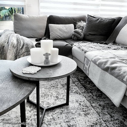 Earl Nesting Coffee Table Set of 2 - Concrete, showcasing sleek round tabletops and a sturdy metal frame, ideal for modern interiors with versatile, space-saving design. Displayed in a contemporary indoor setting.