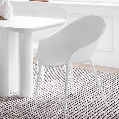 Eidos Indoor/Outdoor Modern Plastic Dining Chair w/ Armrest White Set of 2 displayed on a rug, showcasing its sleek design and armrests, perfect for enhancing indoor or outdoor dining spaces.