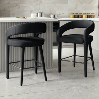 Eisha Velvet Bar Stool Black Set of 2, featuring luxurious velvet upholstery, curved backs with armrests, and built-in footrests, ideal for enhancing dining areas or bars with comfort and style.