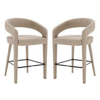 Eisha Velvet Bar Stool Warm Grey Set of 2 showcases a pair of stylish stools with black legs, curved backs, and armrests, perfect for modern bars or dining areas.