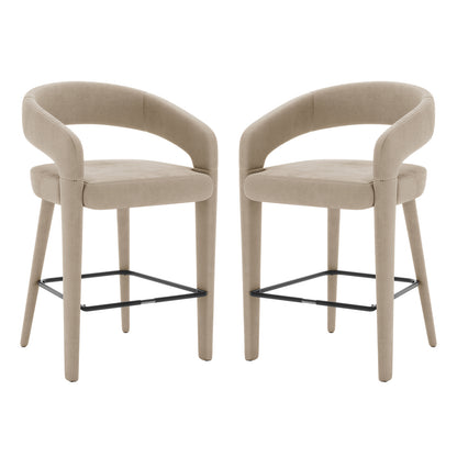 Eisha Velvet Bar Stool Warm Grey Set of 2 showcases a pair of stylish stools with black legs, curved backs, and armrests, perfect for modern bars or dining areas.