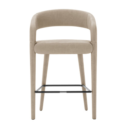 Eisha Velvet Bar Stool Warm Grey Set of 2 features a close-up view showing luxurious velvet upholstery, soft foam padding, and a sturdy metal frame with a curved back and armrests for stylish comfort.
