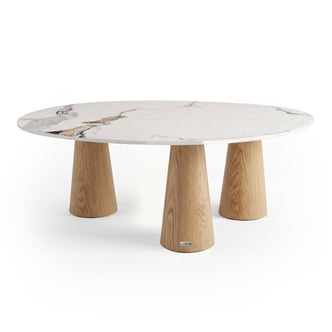 Modern oval table with white marble-look top and natural wood cylindrical legs on a white background