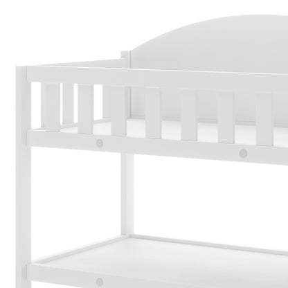 Elisabeth Solid Pine Baby Change Table with Storage in White, featuring a close-up of the top bunk guardrail slats and shelving/platform below, showcasing its sturdy design and functional storage shelves.