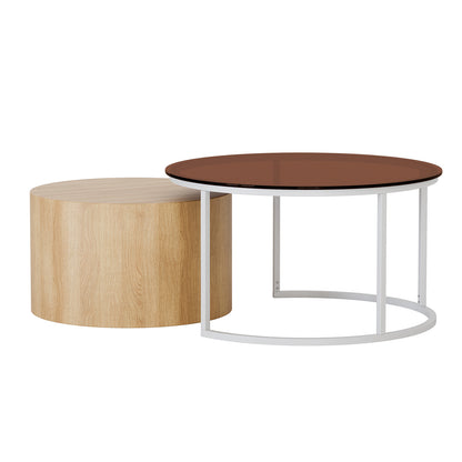 Ellisha Round Nesting Coffee Table in Natural, featuring a cylindrical light oak wood-grain table and a low circular table with a white metal frame and brown glass top, showcasing modern design.